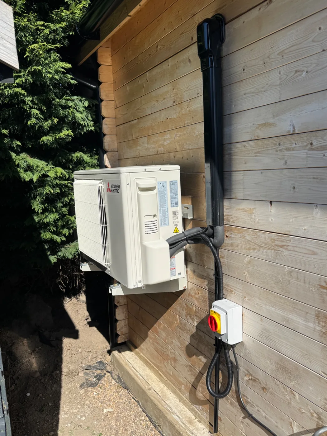 Outdoor air conditioning unit mounted on a timber building